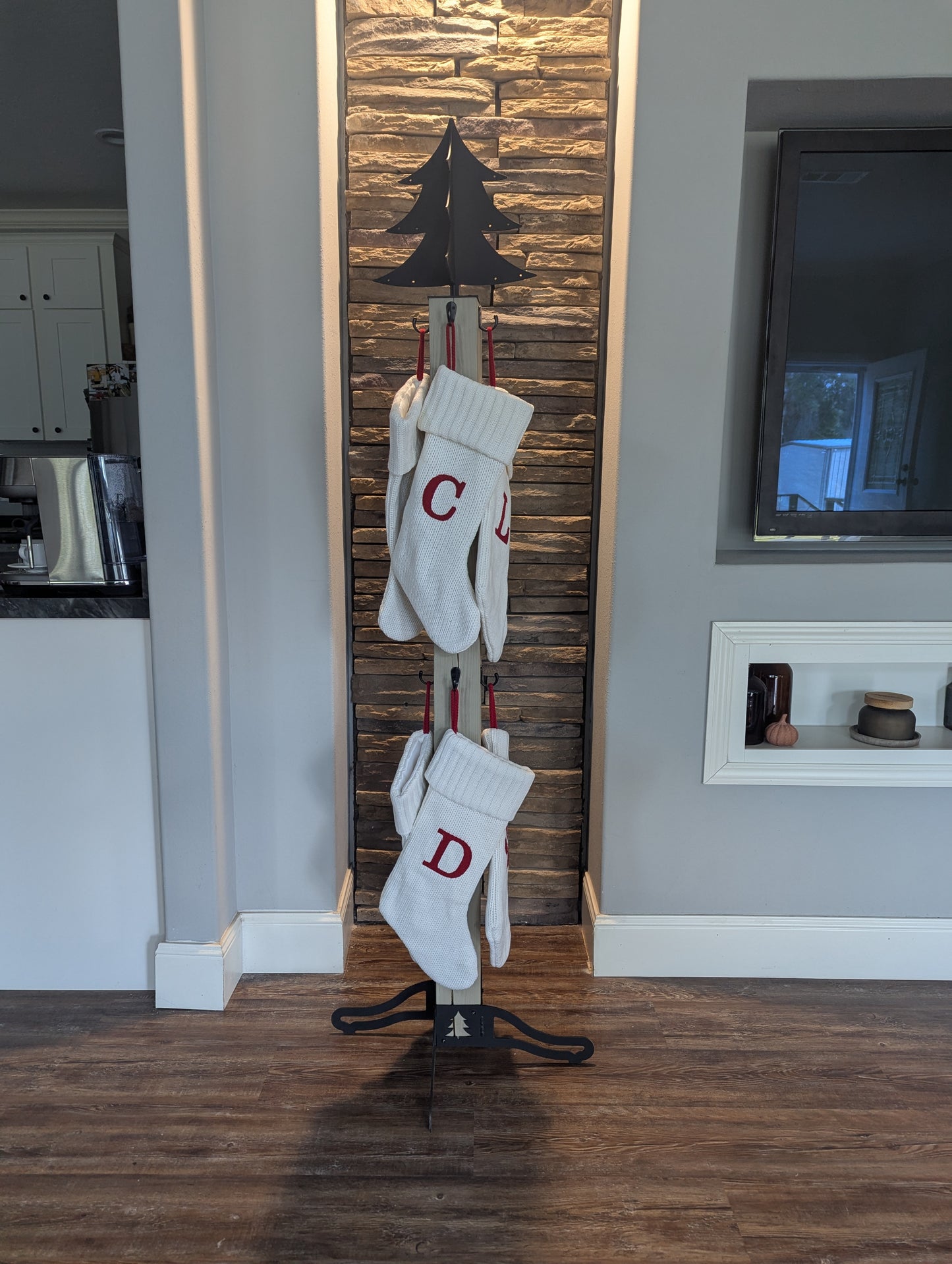 Christmas tree stocking stand with 8 stockings.