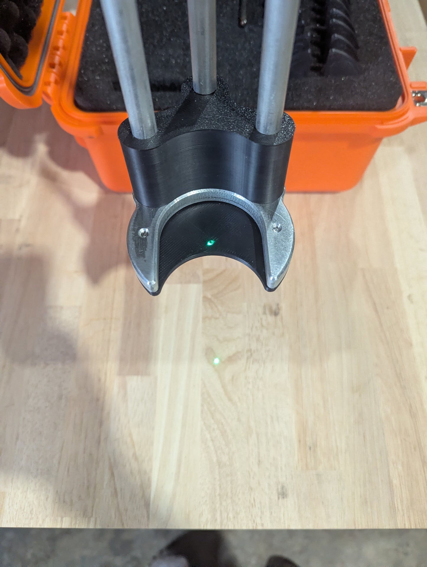 Shields Dead Center Jig with laser plummet shining through the alignment hole.