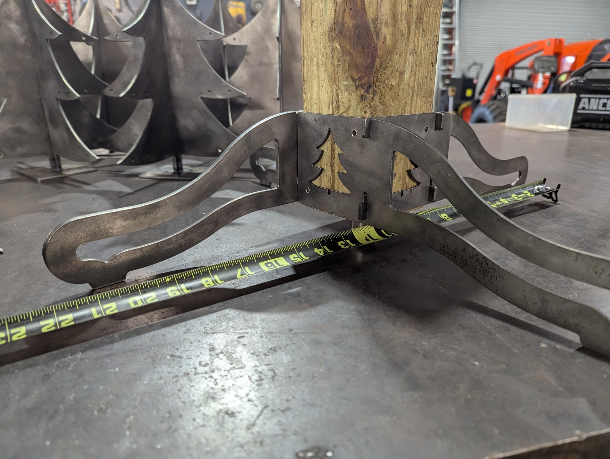 Metal Base Brackets for the Christmas Stocking Stand assembled with tape measure showing width of base assembled.