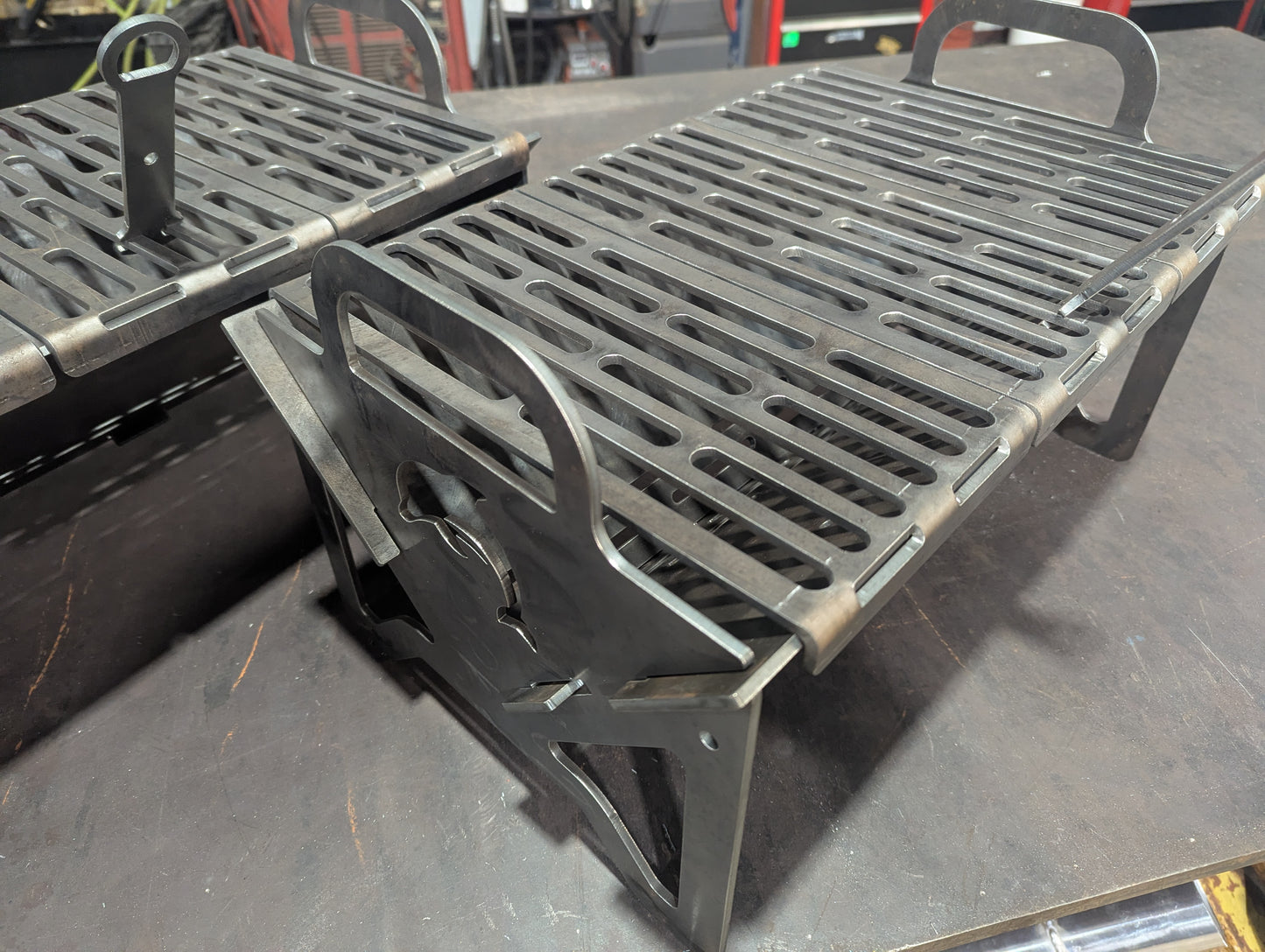 Flat pack grill with dolphin logo.