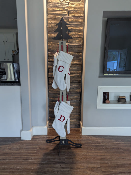 Christmas tree stocking stand with 8 stockings.